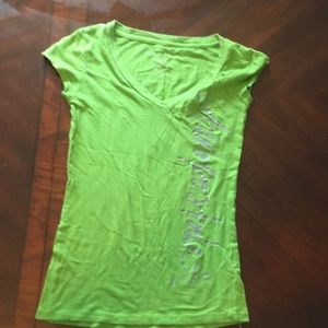 Green shirt that says aeropostale in cursive